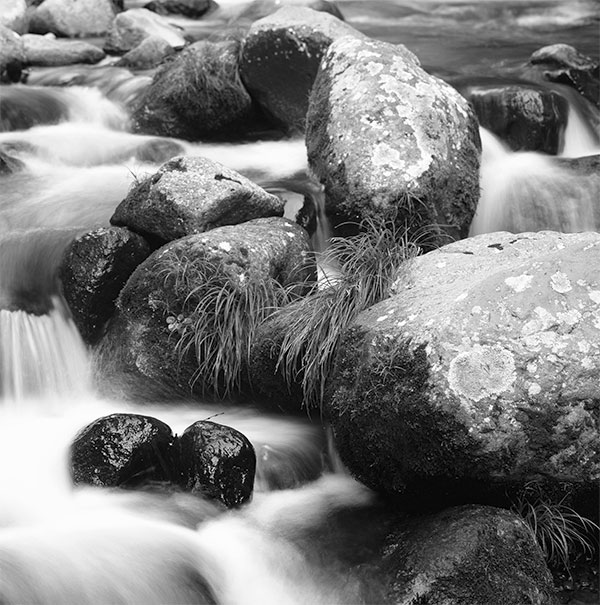 decorative photo of rocks in a stream of water